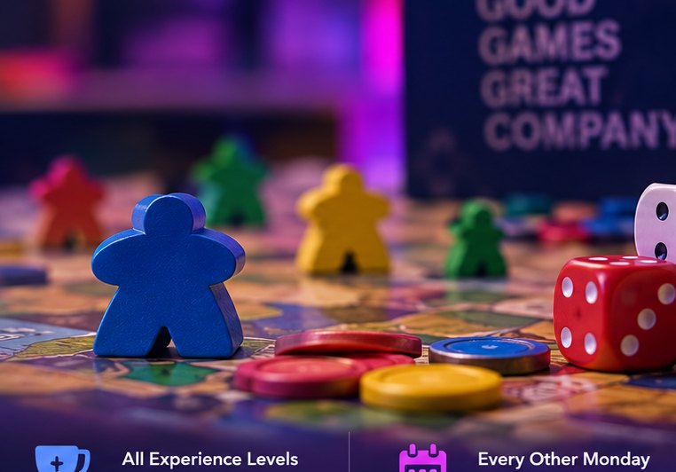 Board game pieces on a table during a club game night